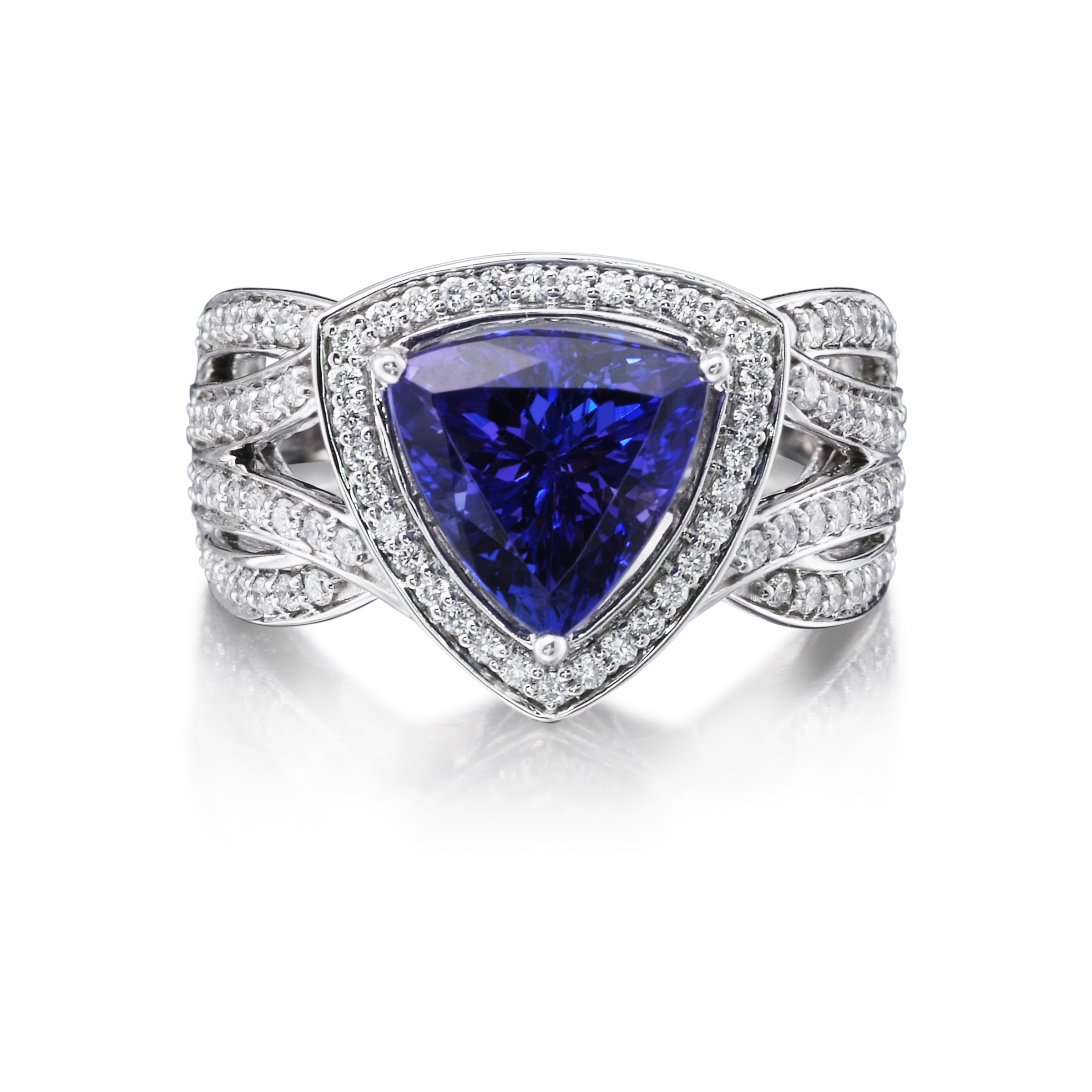 Trillion-cut violet-blue tanzanite ring set in a woven band of pave diamonds