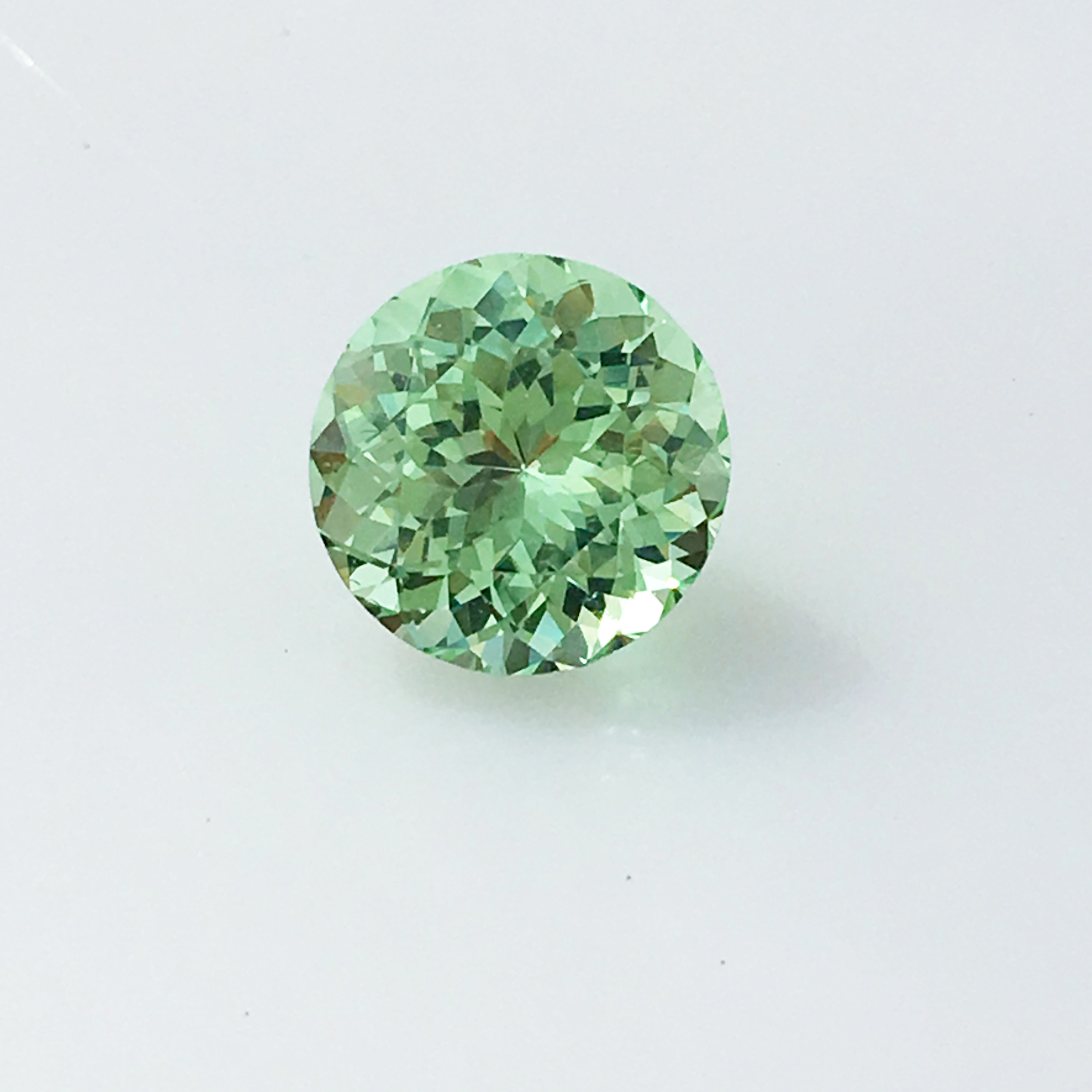 A round brilliant cut mint green garnet