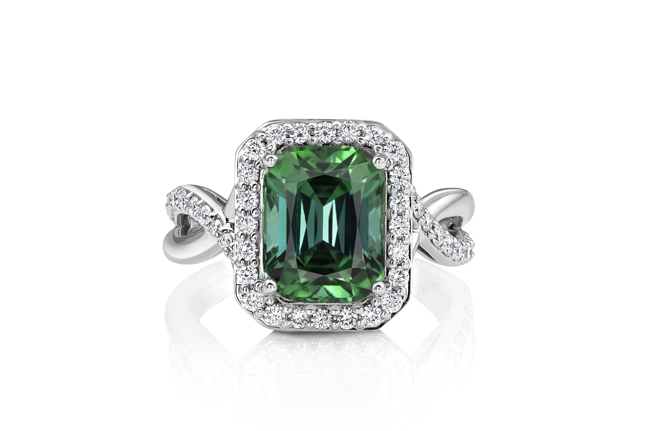 Emerald-cut green tourmaline ring with a diamond halo and crossover shank