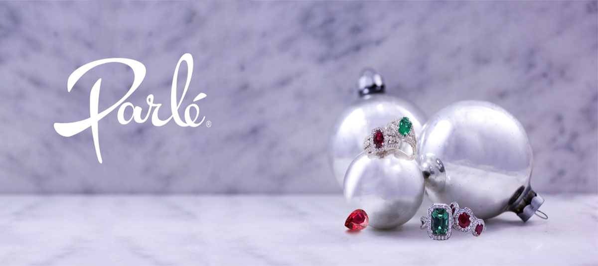 Parle holiday banner: coloured gemstone rings displayed beside silver baubles
