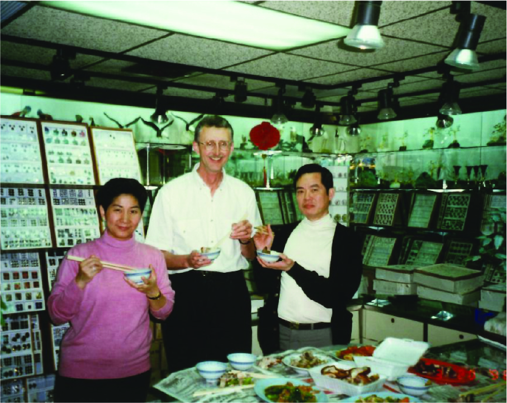 Frank eating with vendors at a visit