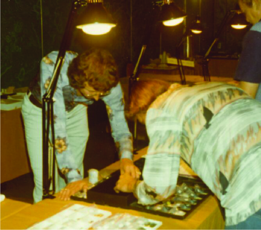 Frank showing gems to a customer