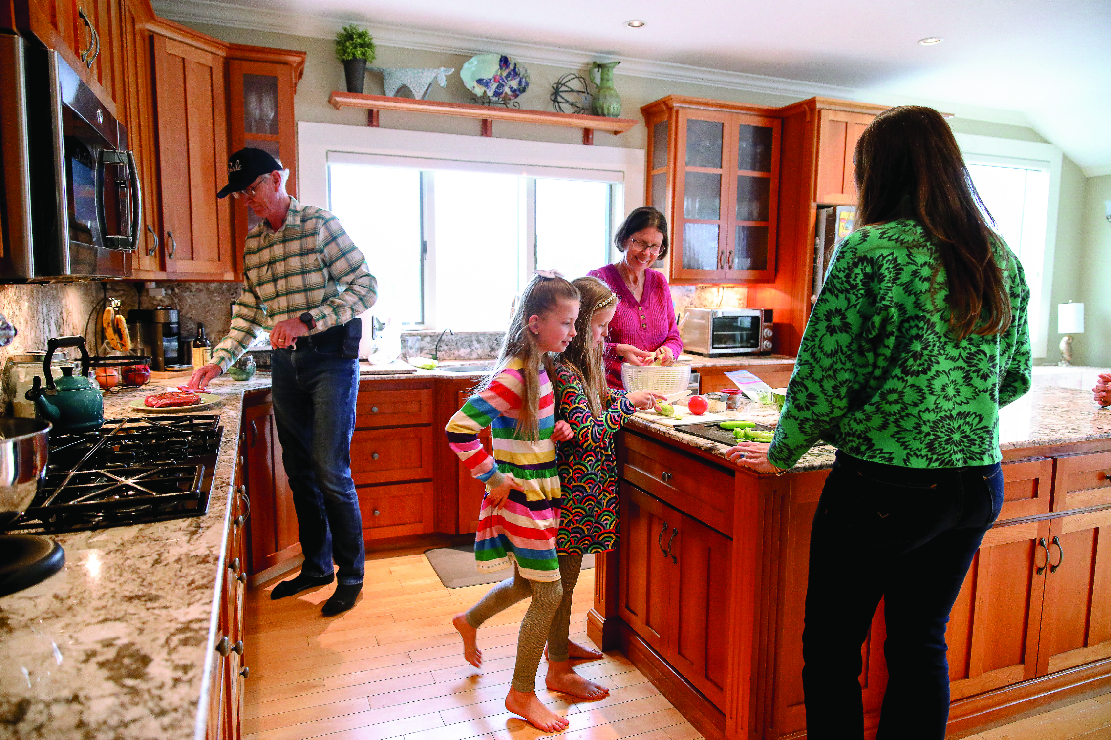 Three generations of Farnsworths together, making a meal